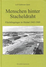 Menschen hinter Stacheldraht