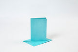 KORT OG KUVERTER KORT 10,5X15 CM BLÅ PERLEMOR 4SÆT
