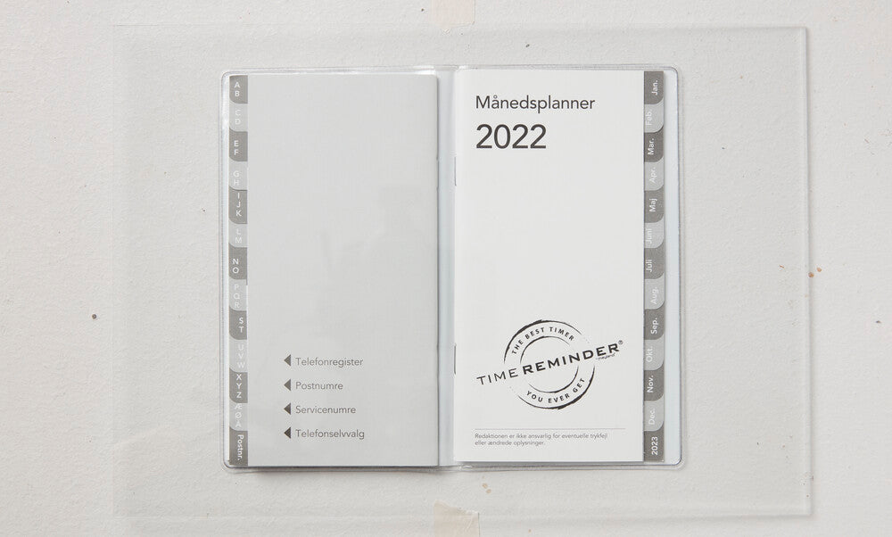 Månedskalender 2022 blomst/grene i orange/grønne farver